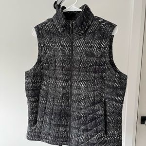 Woman’s North Face black printed puffer vest.